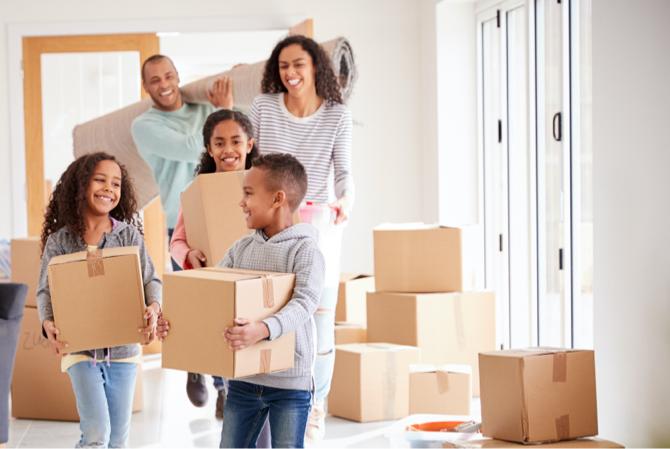 A family moving boxes together.